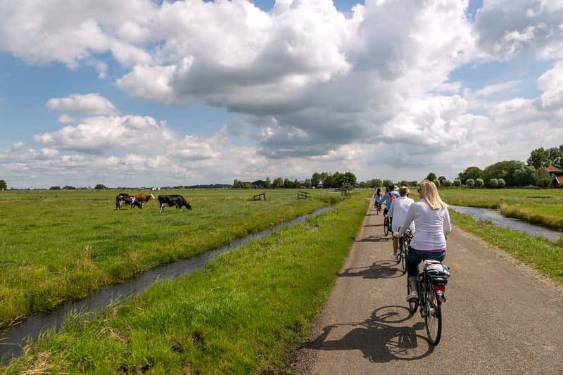 Amsterdam: Windmill, Cheese, and Countryside E-Bike Tour - Getting Out of Amsterdam Fast: Ferry, A’DAM Tower, and the Start of Waterland