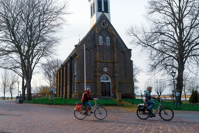 Cheese, Canals & Windmill Countryside E-Bike Tour Amsterdam - Nieuwendammerdijk: Green Houses, Old Captains, and the Dutch Way of Doing It