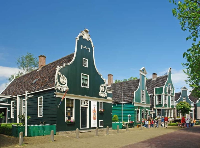 From Amsterdam: Volendam and Zaanse Schans Tour with Cheese - First Stop: Leaving Amsterdam Central for the Zaan Windmill Area