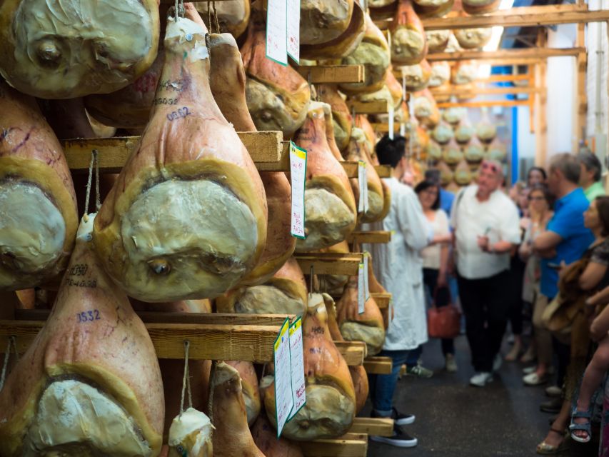 From Bologna: Parma Cheese & Ham Factory Tours and Tastings - Parmigiano Reggiano factory tour: milk rooms to aging warehouses