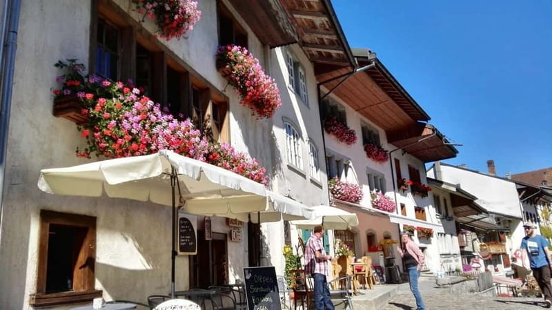 From Geneva: Gruyères Tour with Cheese & Chocolate Factories - GoldenPass Panoramic train: optional scenic ride in season