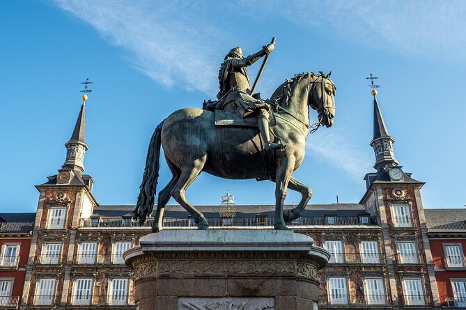 Madrid Bike Tour with Churros and Wine, Ham, and Cheese Upgrade - Buen Retiro’s Quirky Corners: The Fallen Angel, San Jerónimo, and Neptune